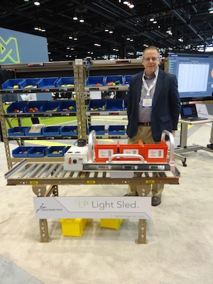 Matthews Automation Solutions' president Paul Jensen with the LP Sled at ProMat. Photo courtesy of Modern Materials Handling