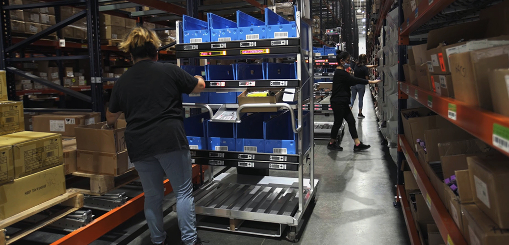 Women Using Automated Pick to Light Picking Cart for Order Picking
