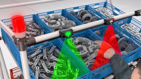 Employee using Pick-to-light system to error proof parts picking process