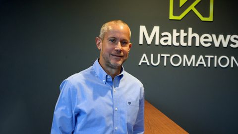 Peter Gerbitz, Lightning Pick Systems Sales Manager at Matthews Automation, standing in the lobby of Matthews' Waukesha WI office.