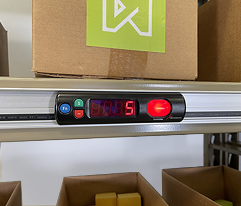 Pick-to-light module showing quantity to pick for order fulfillment